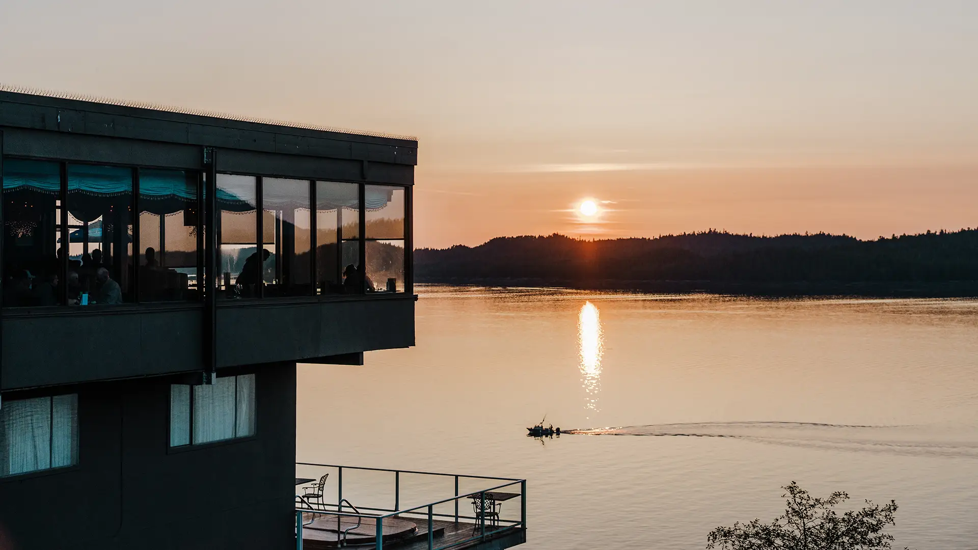 Crest Waterfront Restaurant at sunset over the water