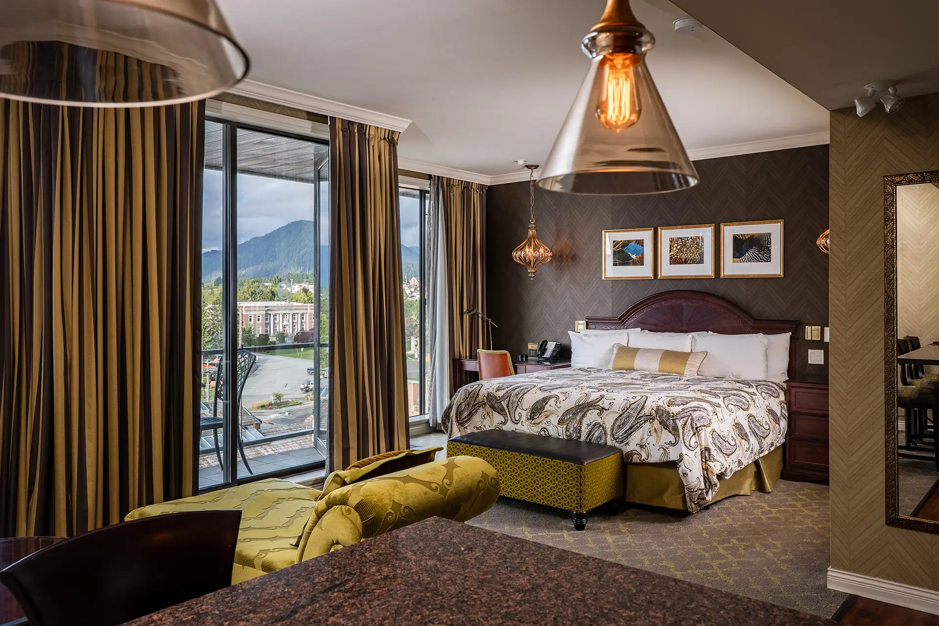 Crest Hotel suite with bed and lounge seating